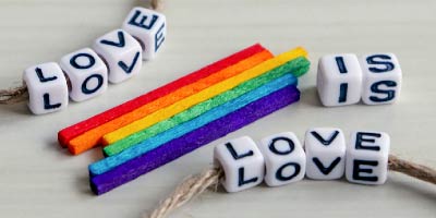 Love is love bracelet with LGBTQ rainbow trim