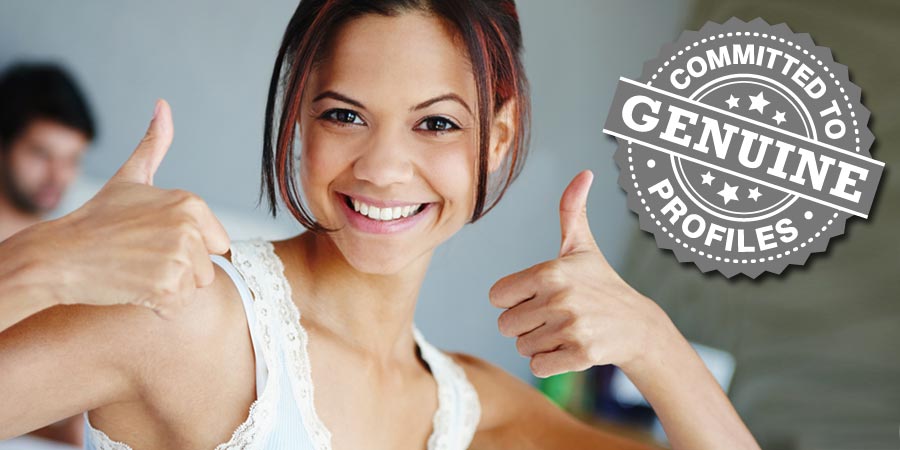 A genuine member! Beautiful woman celebrates with two thumbs up.