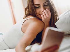 Young woman video chatting on her mobile device