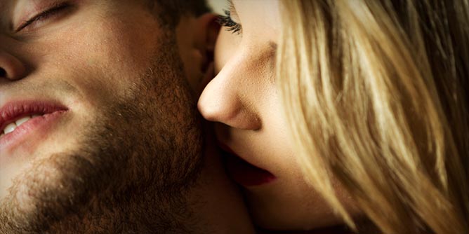 Woman kissing her partner's neck which is an erogenous zone