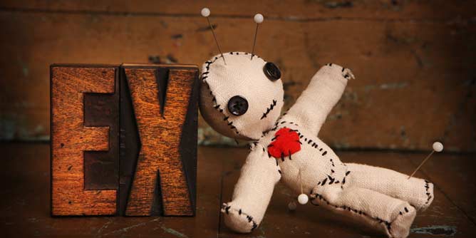 A voodoo doll representing an ex partner with pins stuck into it for revenge