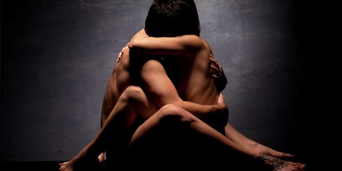 Man and woman sharing an intimate moment in each other's arms