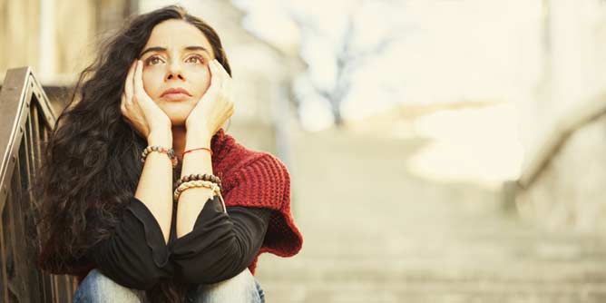 Attractive woman looking sad after being ghosted by her date