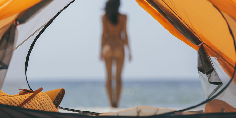 Naked woman going swimming on National Nude Day 