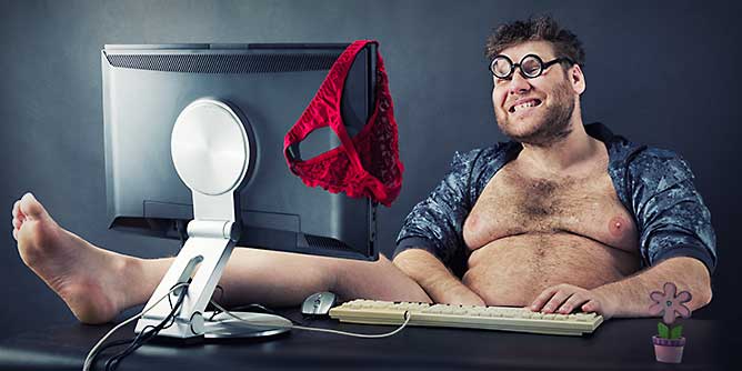 Sleezy overweight man sitting behind his computer creating a fake online dating profile